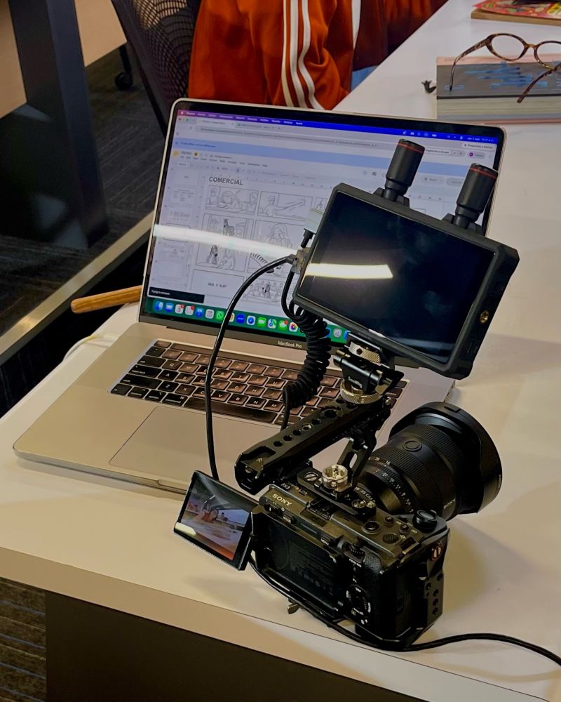 Camera rig on set, with the storyboard open on a laptop behind it.